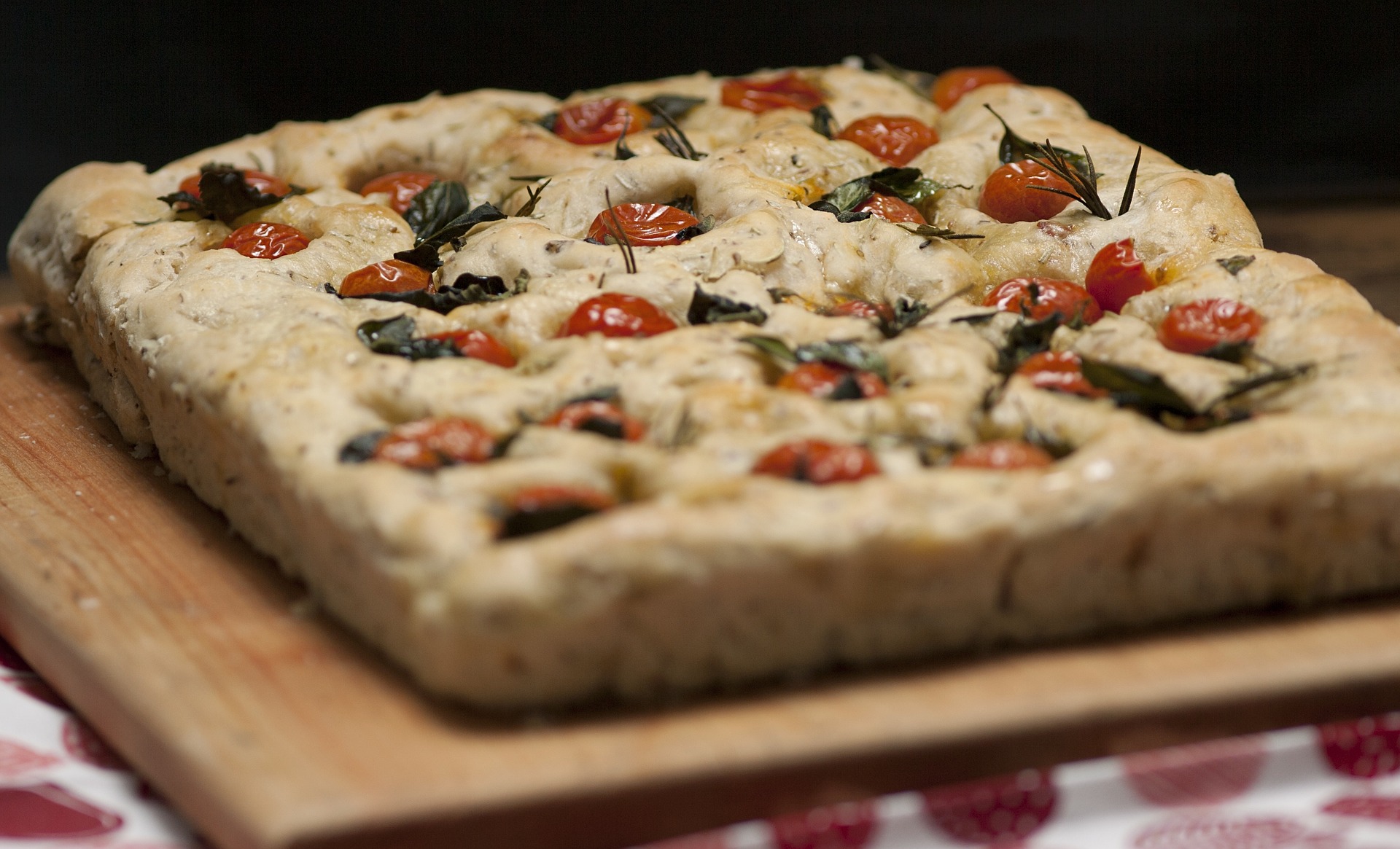 close up photo of cooked focaccia bread on a table